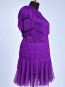 Scalloped purple fringe tiers close-up