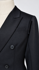 Peak lapel and chest pocket detail