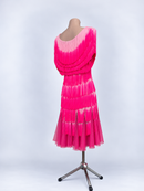 Deep scoop back with curved fringe