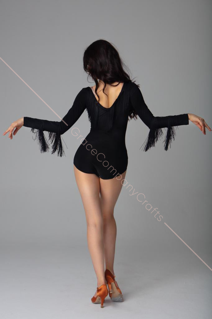 Black bodysuit with long sleeves and fringe. Bodysuit with an open back