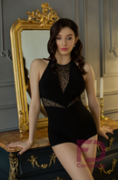 Black bodysuit with stretch mesh panels. Open back bodysuit