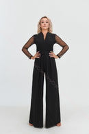 Black jumpsuit with polka dot mesh sleeves