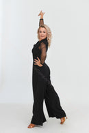 Black jumpsuit with polka dot mesh sleeves