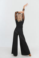 Black jumpsuit with polka dot mesh sleeves