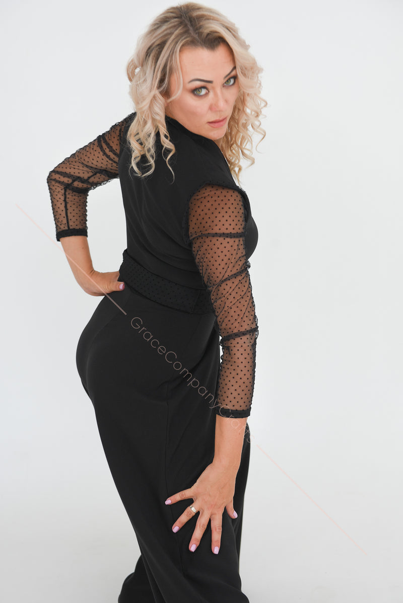Black jumpsuit with polka dot mesh sleeves