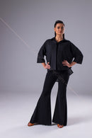 An oversized black blouse for dancing