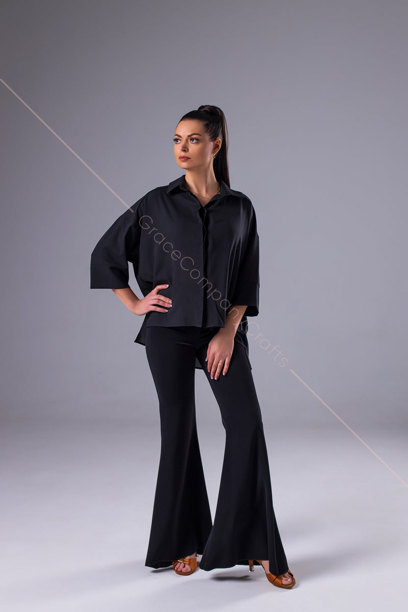 An oversized black blouse for dancing