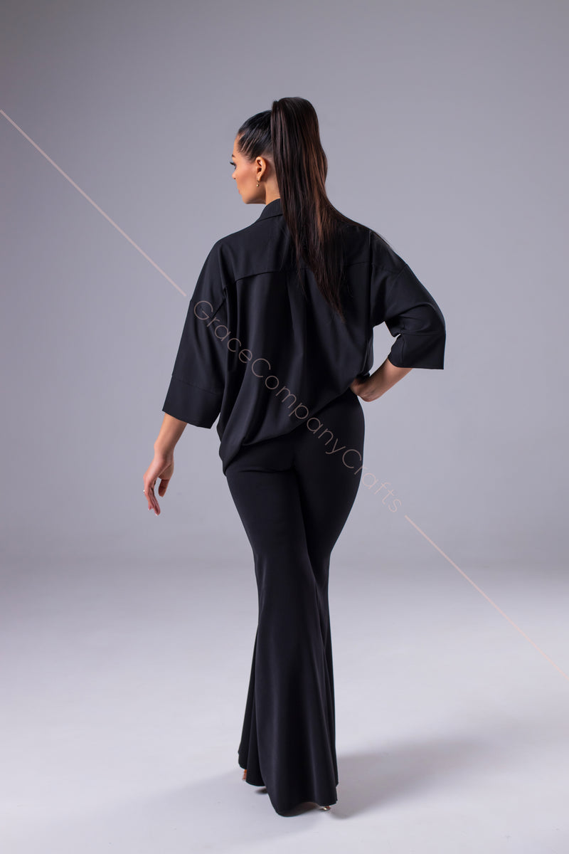 An oversized black blouse for dancing